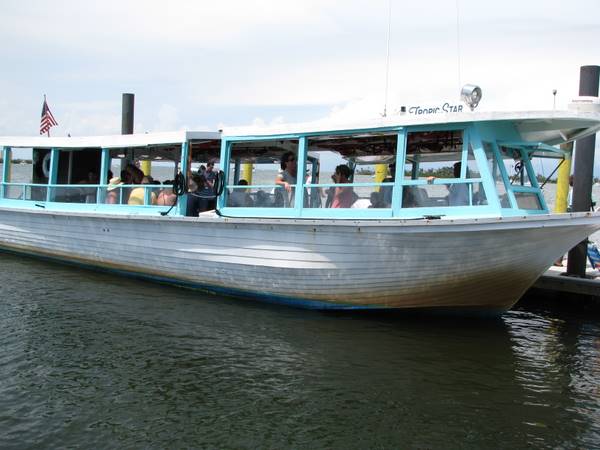 Tropic Star boat arriving at the dock on Cayo Costa Island.