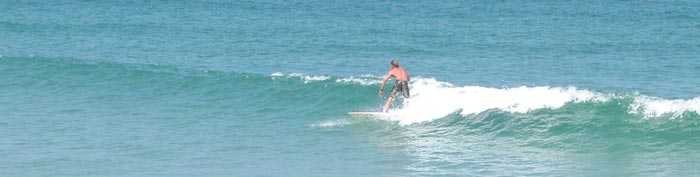 Surfing at Ponce De Leon Inlet jetty