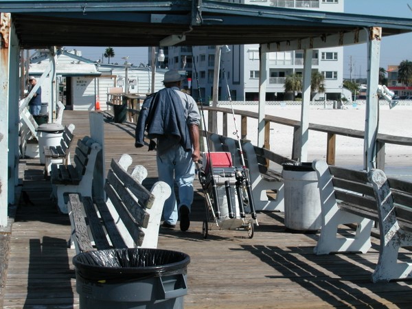 Well-equipped fisherman on the Long Pier, Redington Shores, Florida