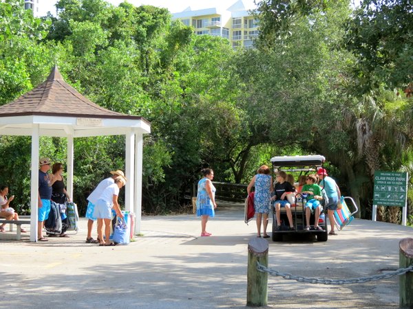 Boarding the tram to Clam Pass beach.